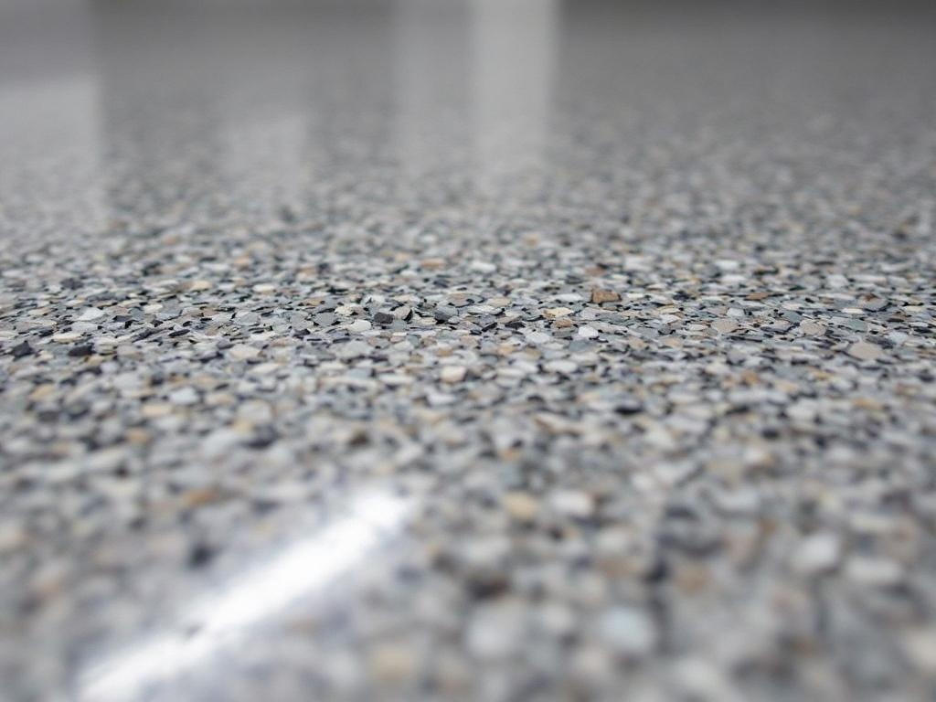 Macro close-up of gray flake epoxy garage floor with chip detail