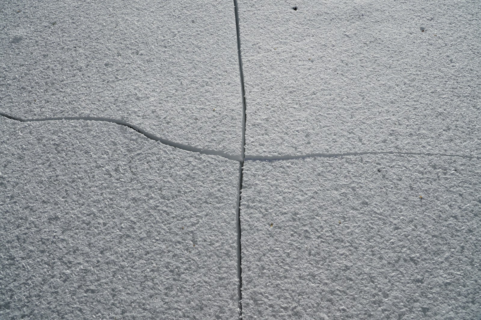 Worn, cracked, oil-stained concrete - the typical condition we restore
